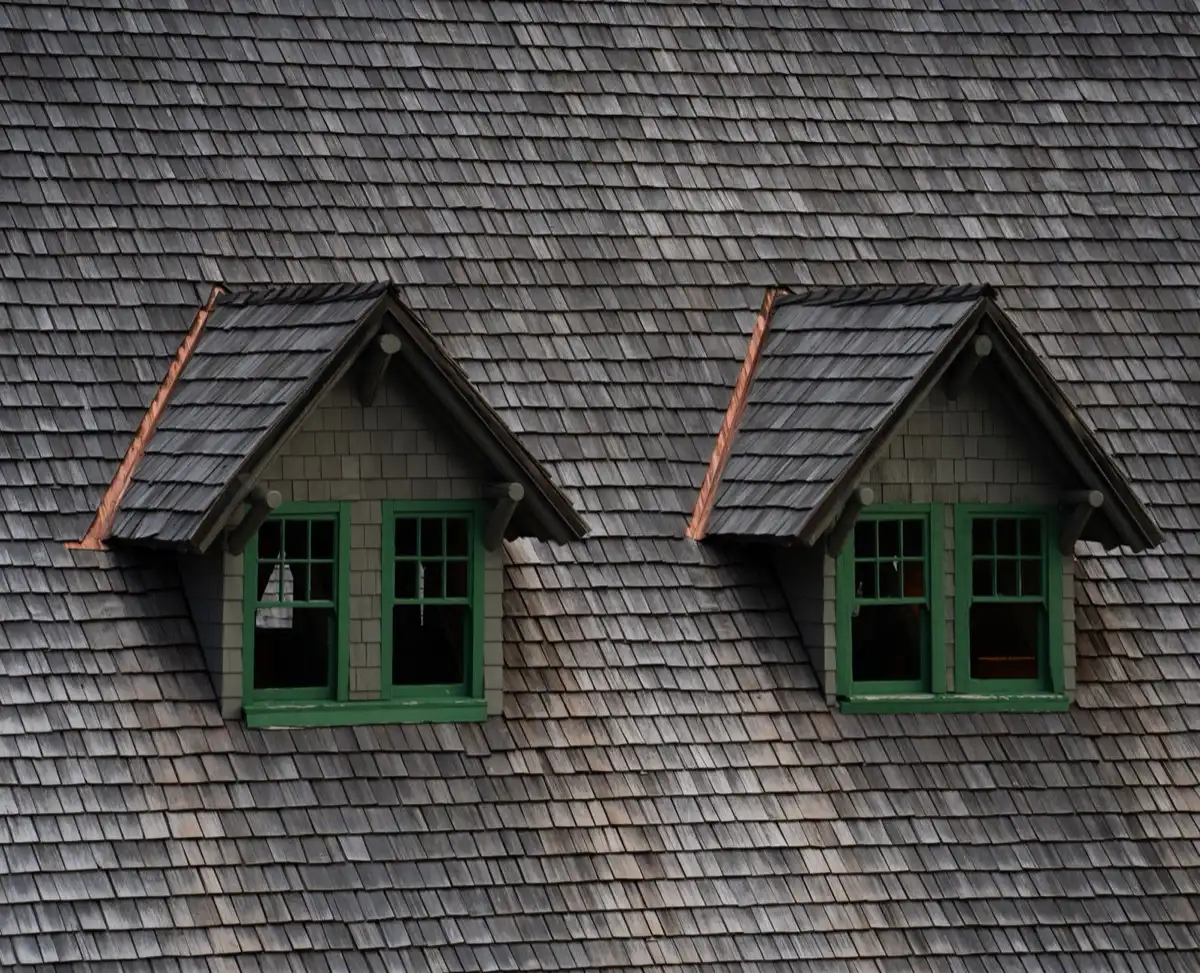 Dormers on a shingle roof in Warren, MI, where step flashing and kickout flashing carry water past the walls