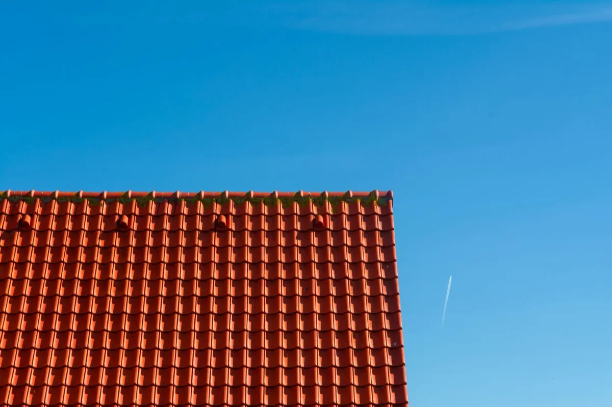 Tile roof gable in full sun, the kind of exposure that sets roof life in Warren, MI